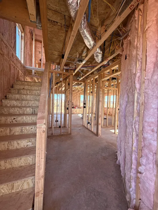 Two Story — Insulation before wallboard
