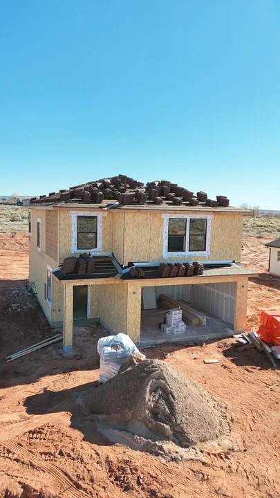 Two Story — Roof tiles stocked before laying