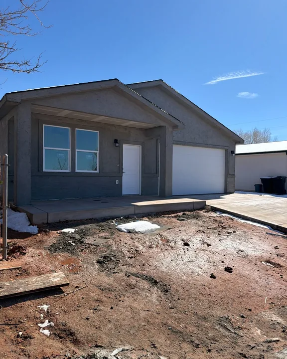 3 Bed / 2 Bath — Stucco base coat and driveway; yard unfinished