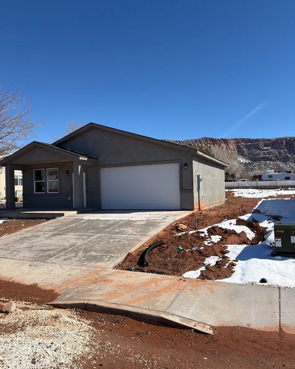 3 Bed / 2 Bath — Stucco base coat and driveway; yard unfinished