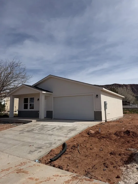 3 Bed / 2 Bath — Exterior finish coat and driveway; yard unfinished