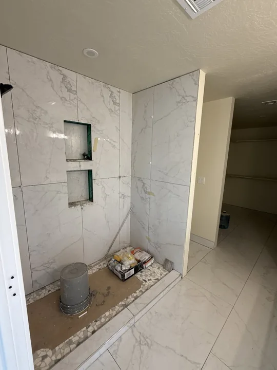 Two Story — Shower tile set with niches unfinished · bathrooms