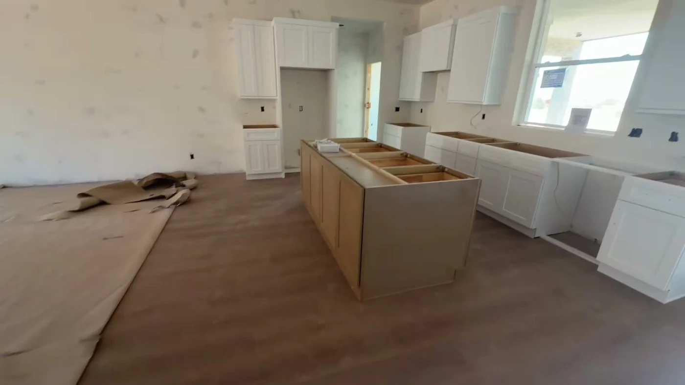 5 Bed / 3 Bath — Cabinet boxes and flooring installed; countertops pending · kitchen